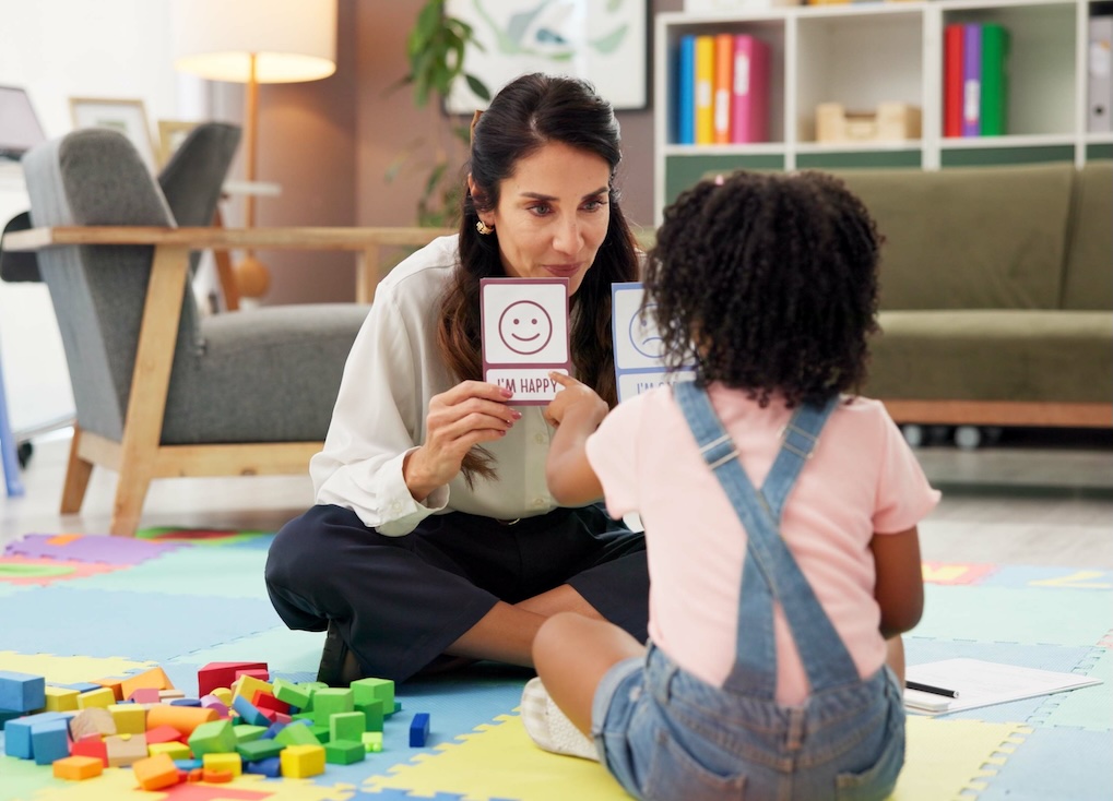 Woman, girl and card with therapy for emotion